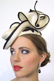 The Boss Woman collection inspired Louise Macdonald's millinery for Melbourne Spring Fashion Week 2010; sophisticated pieces from Boss Woman were complete with directional headpieces and displayed at Hugo Boss Collins Street (Melbourne)