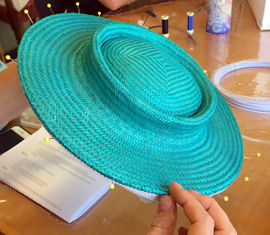 Students creating designer hats in the Buntal Mats workshop at Louise Macdonald's Melbourne studio